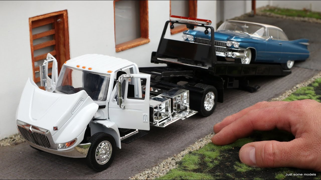 1:24 International DuraStar 4400 flat bad tow truck - Jada