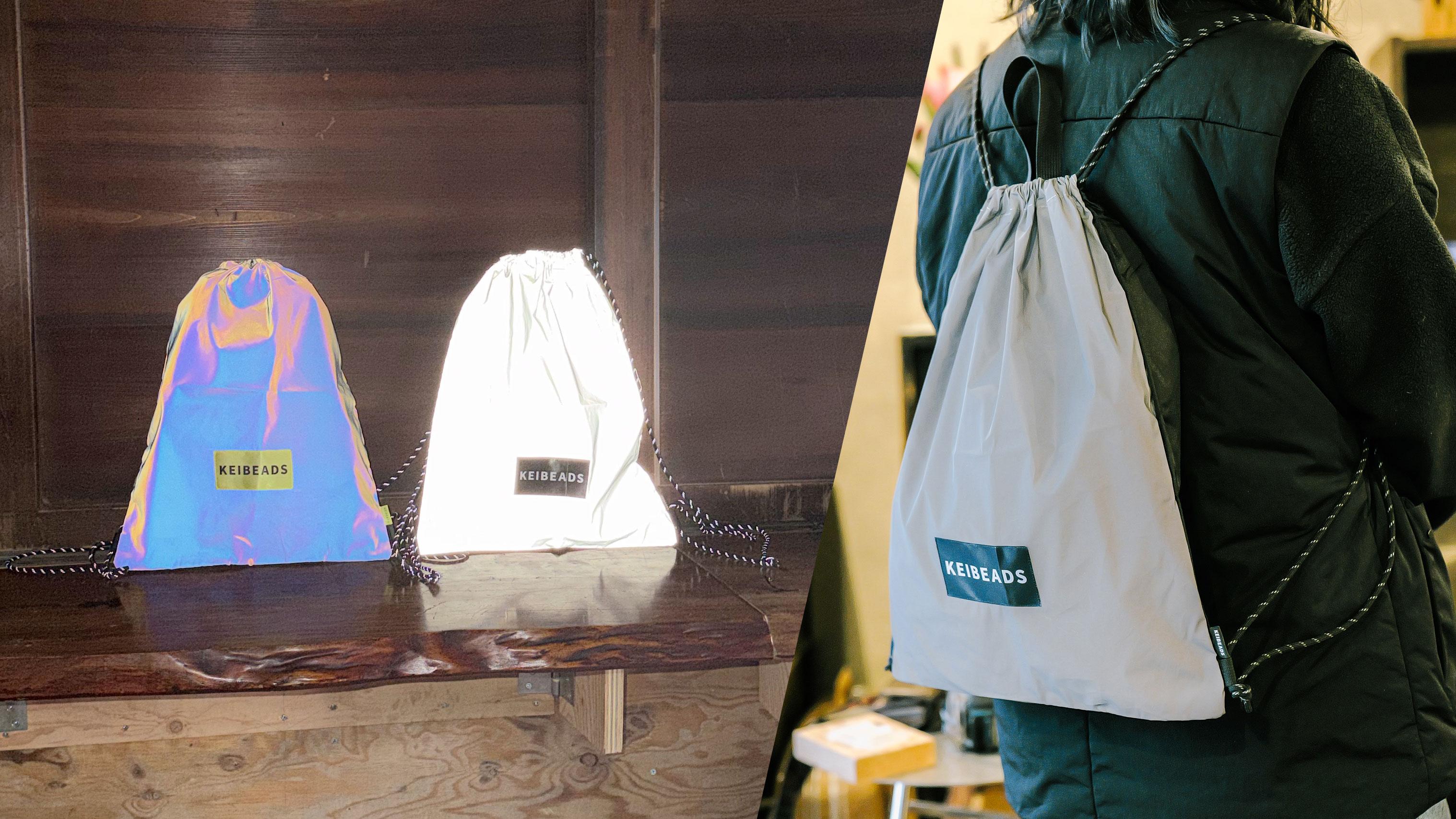 ライトが当たるとめちゃくちゃ光る。特許生地のナップサックで夜道もご