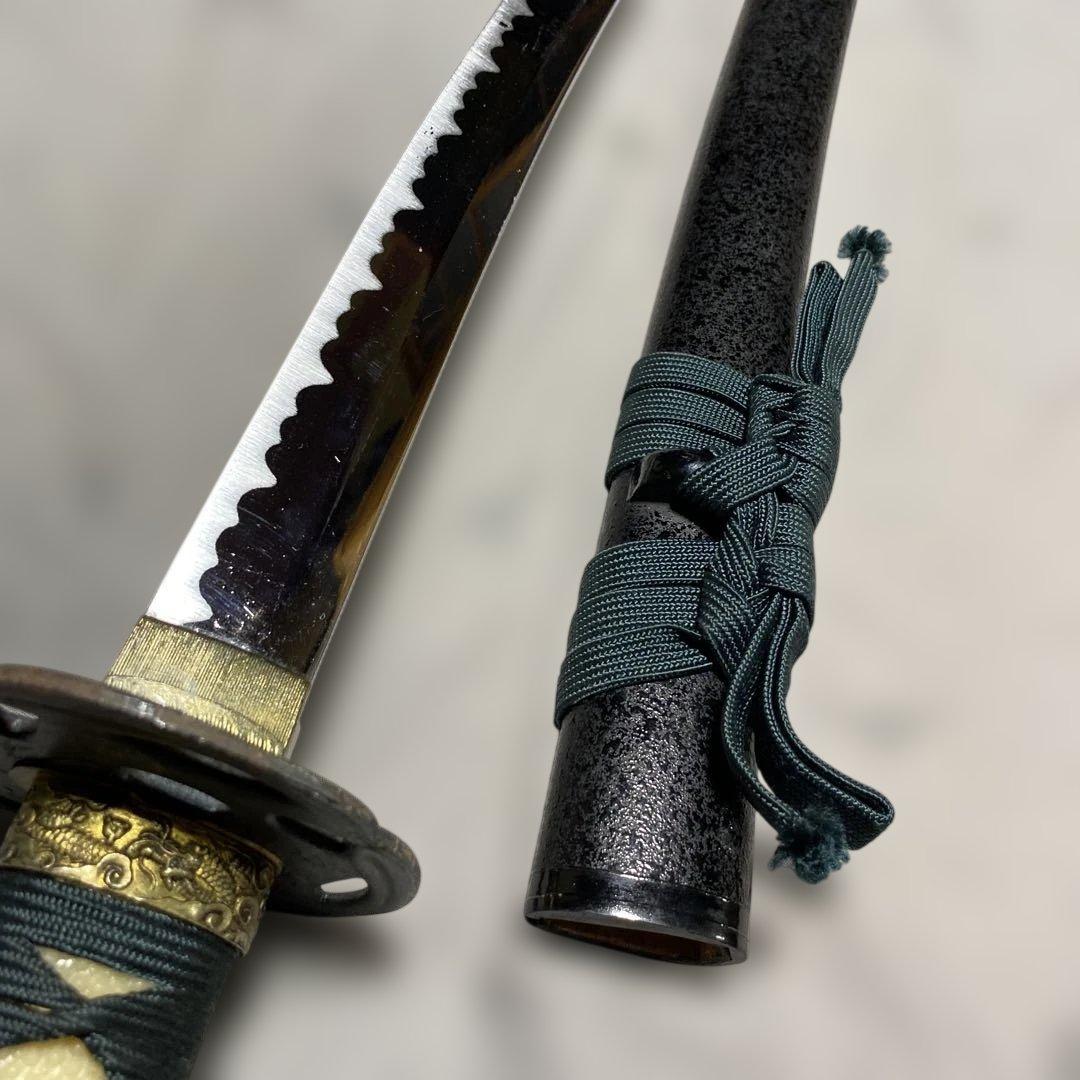 格安模造刀大刀 濃緑柄 波絵透し丸鍔 黒梨地鞘 - メルカリ